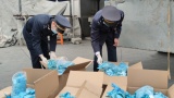 Khởi tố vụ án hình sự về “Tội buôn bán hàng cấm” đối với lô hàng găng tay đã qua sử dụng của Công ty TNHH Ngọc Diệp